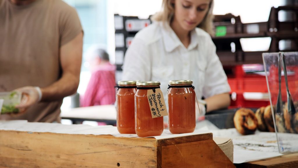 Jam jars sitting on a shop bench