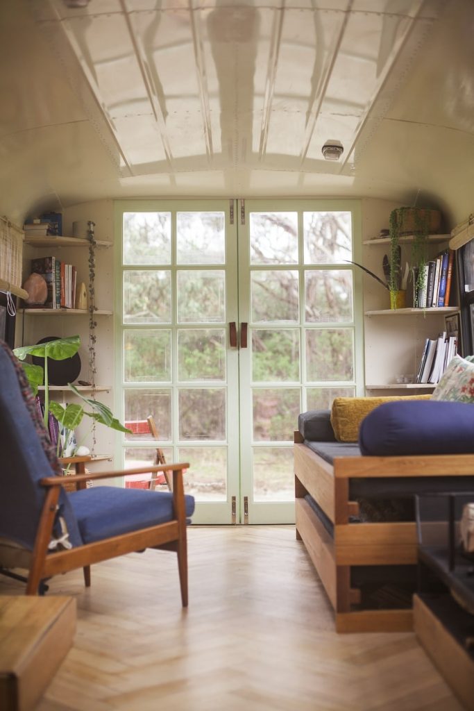 The living room looks out over the rear yard through French doors