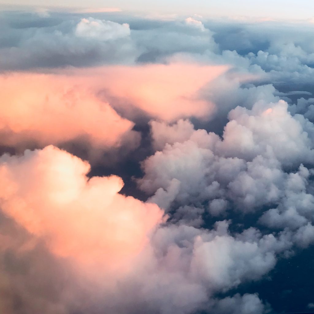 An aerial shot of sunset above the clouds